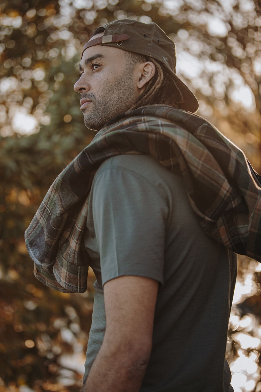Image of man at golden hour with plaid shirt