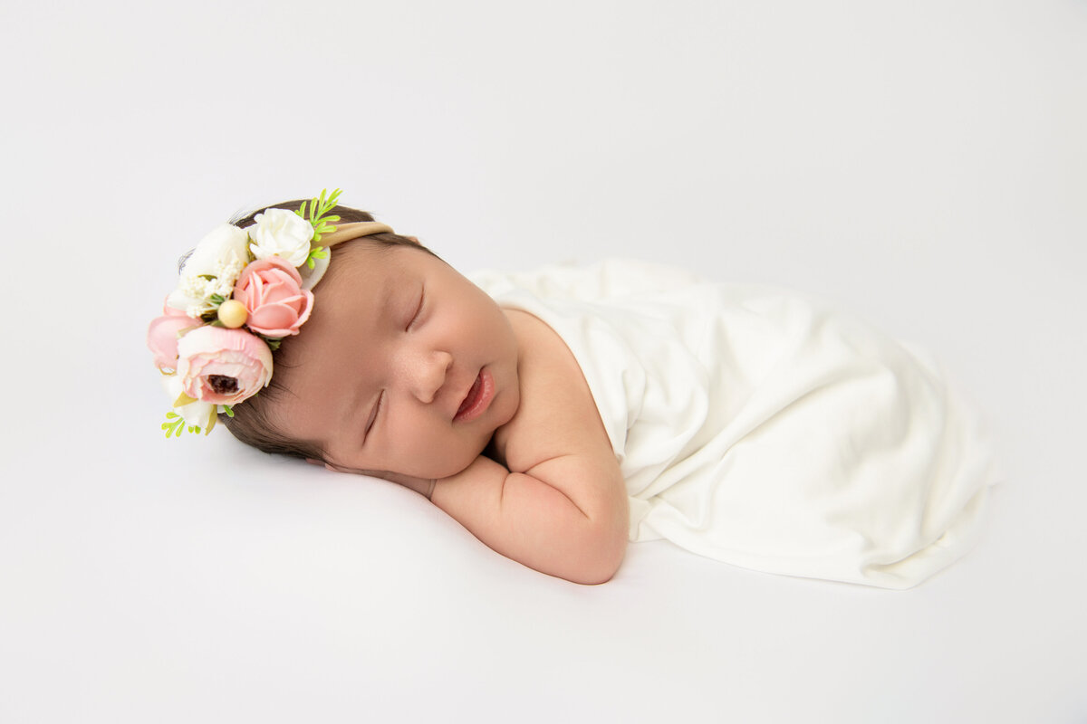Newborn baby girl posed