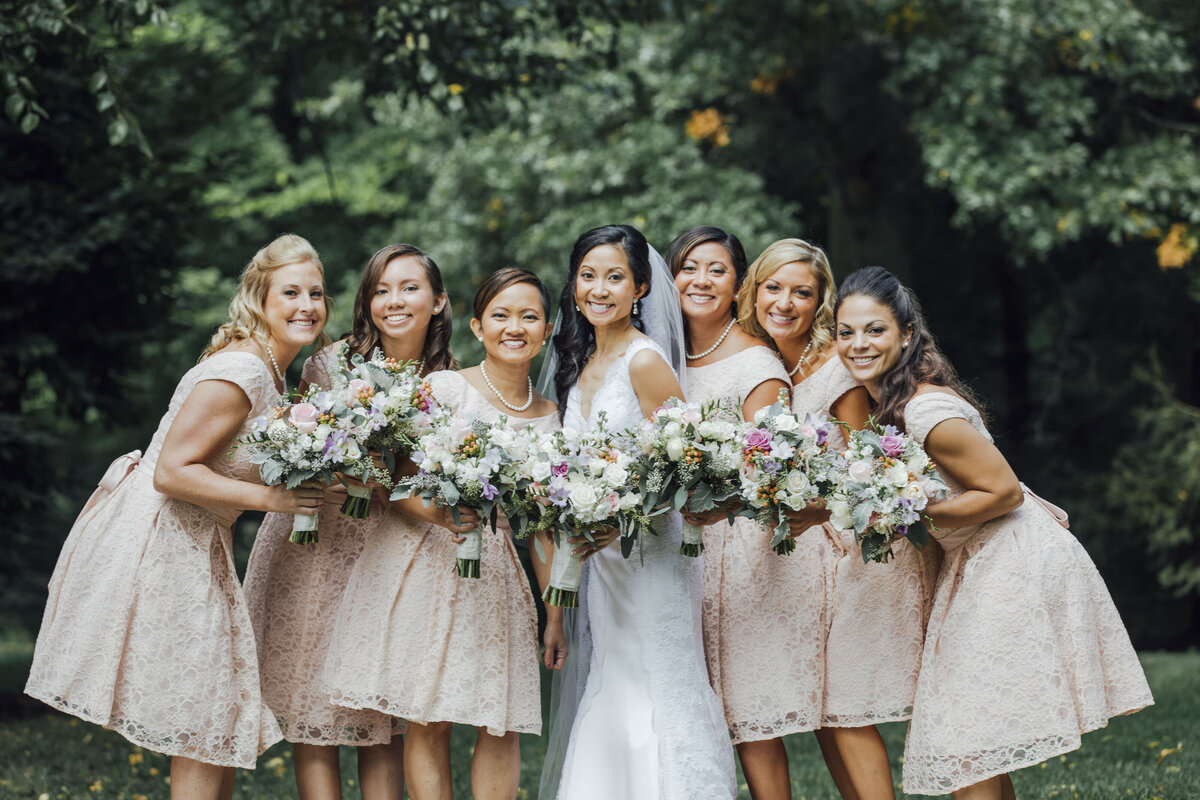 The Olde Mill Inn | Bride with bridesmaids during outdoor summer wedding | Basking Ridge, New Jersey