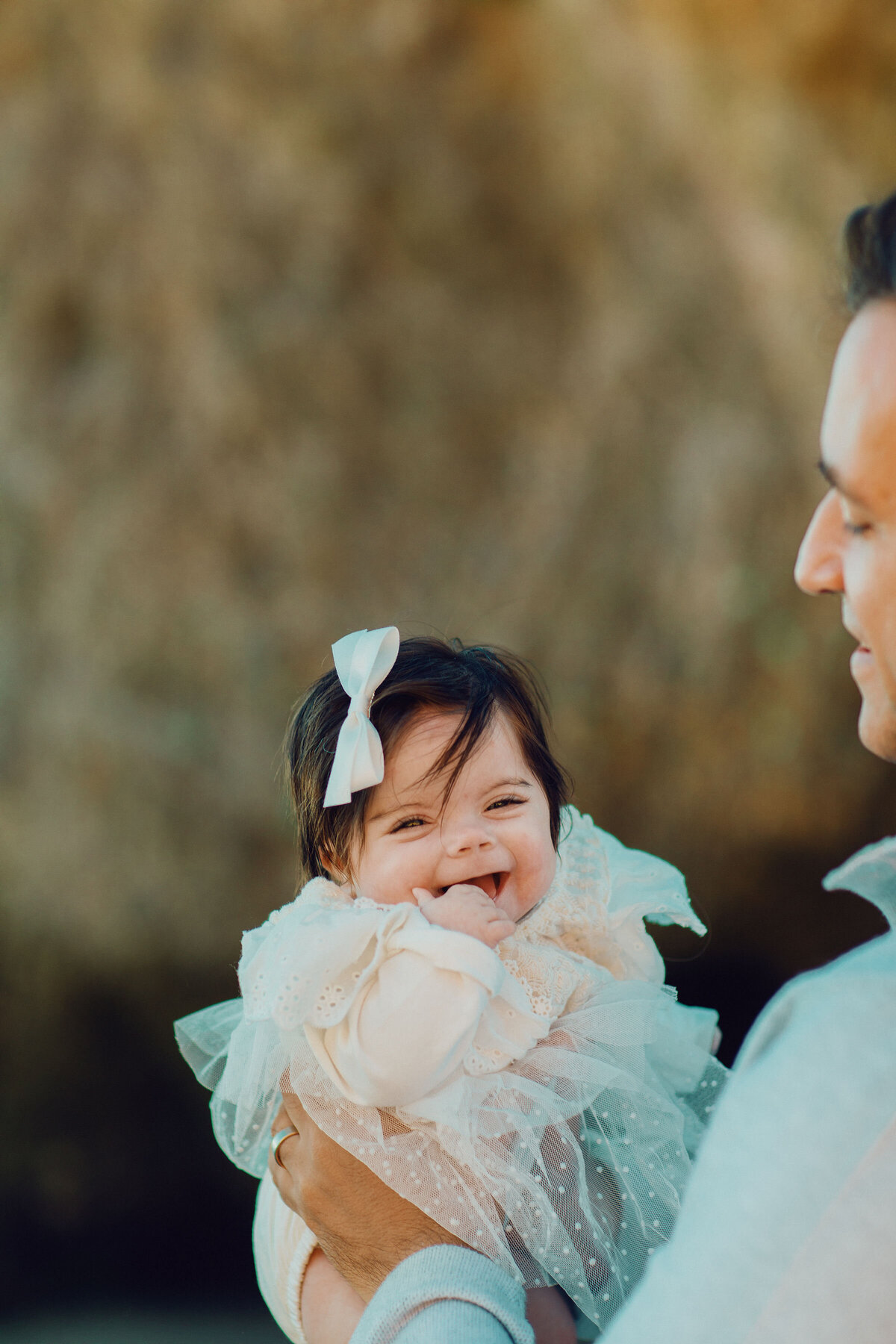 Family Portrait Photo Of Baby In White Dress Los Angeles
