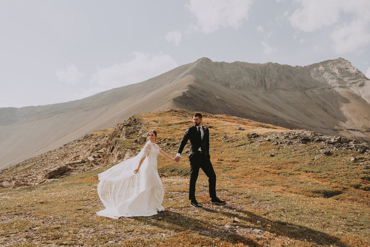 Eloping couple on top of a mountain at Rockies Heli Alberta