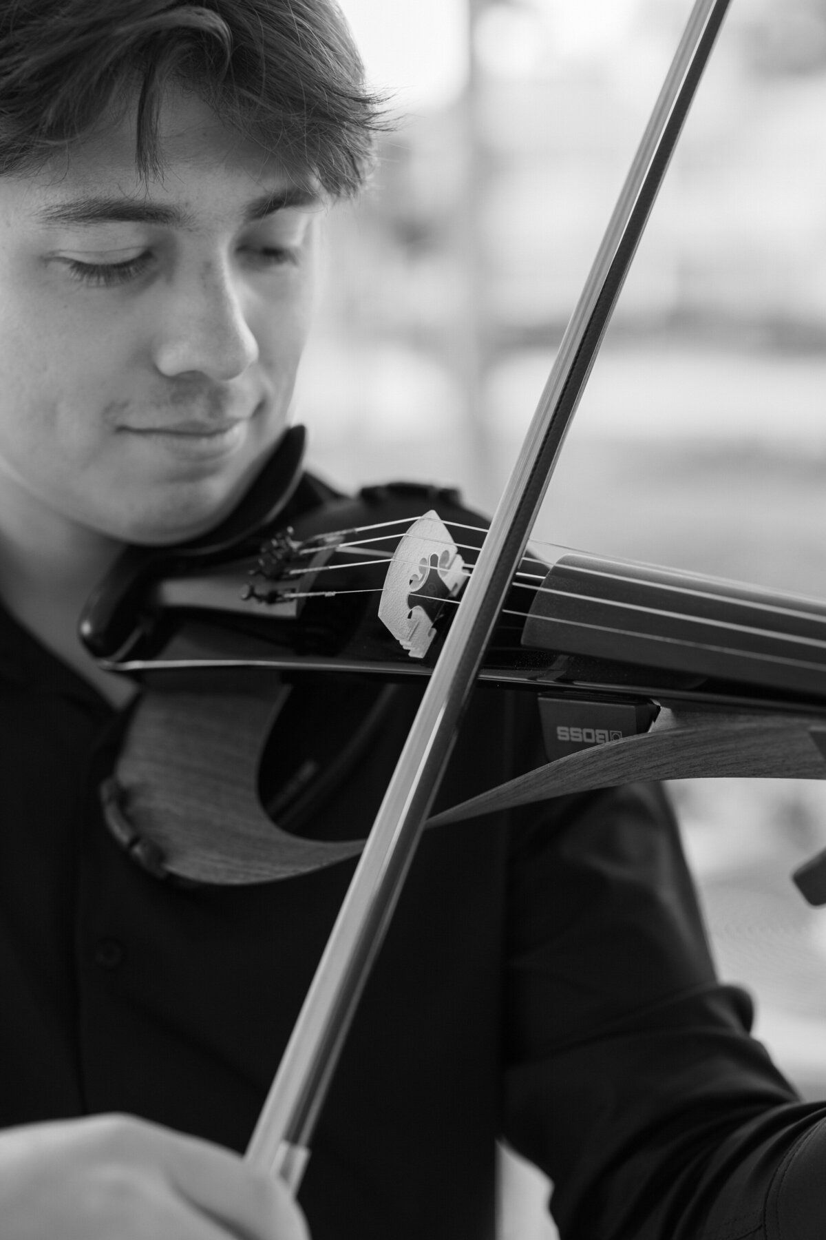Violinist plays at Cancun wedding ceremony, captured by Philadelphia destination wedding photographer.