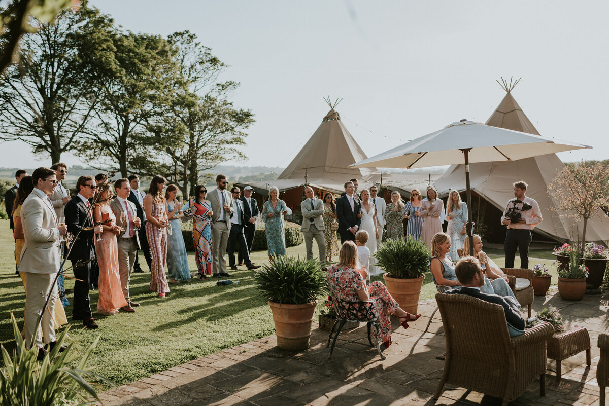 outdoor speeches with tipi tent in back ground