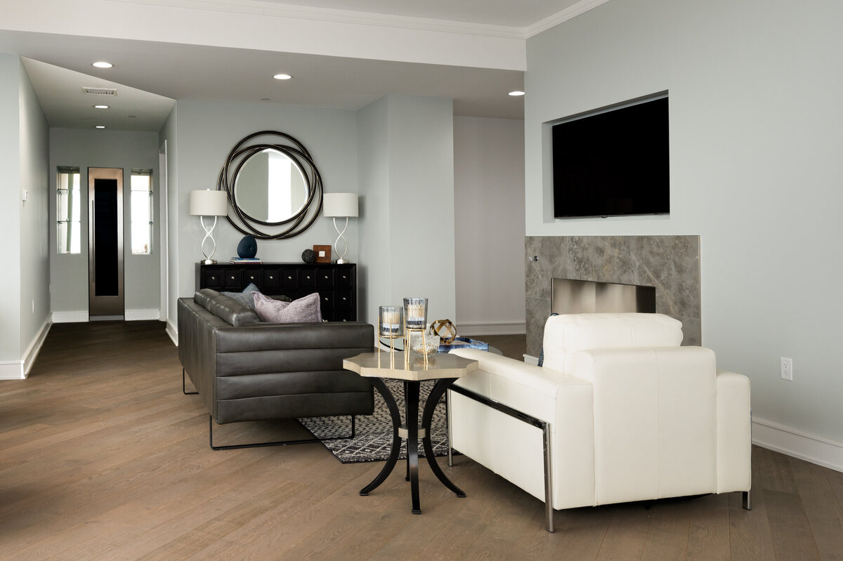 living room with black sofa and white chair