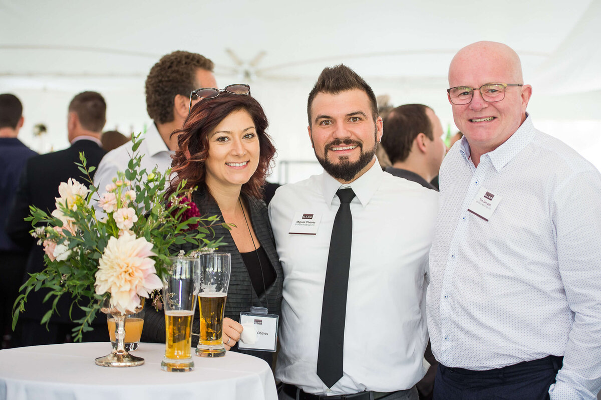 a photo of 3 smiling guests at Ell-Rod 25th Anniversary Celebration. Captured by Ottawa Event Photographer JEMMAN Photography COMMERCIAL   