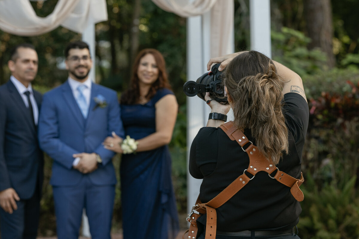 Orlando Wedding photographer taking family portraits after a ceremony at The Garden Villa in Winter Park, Florida.