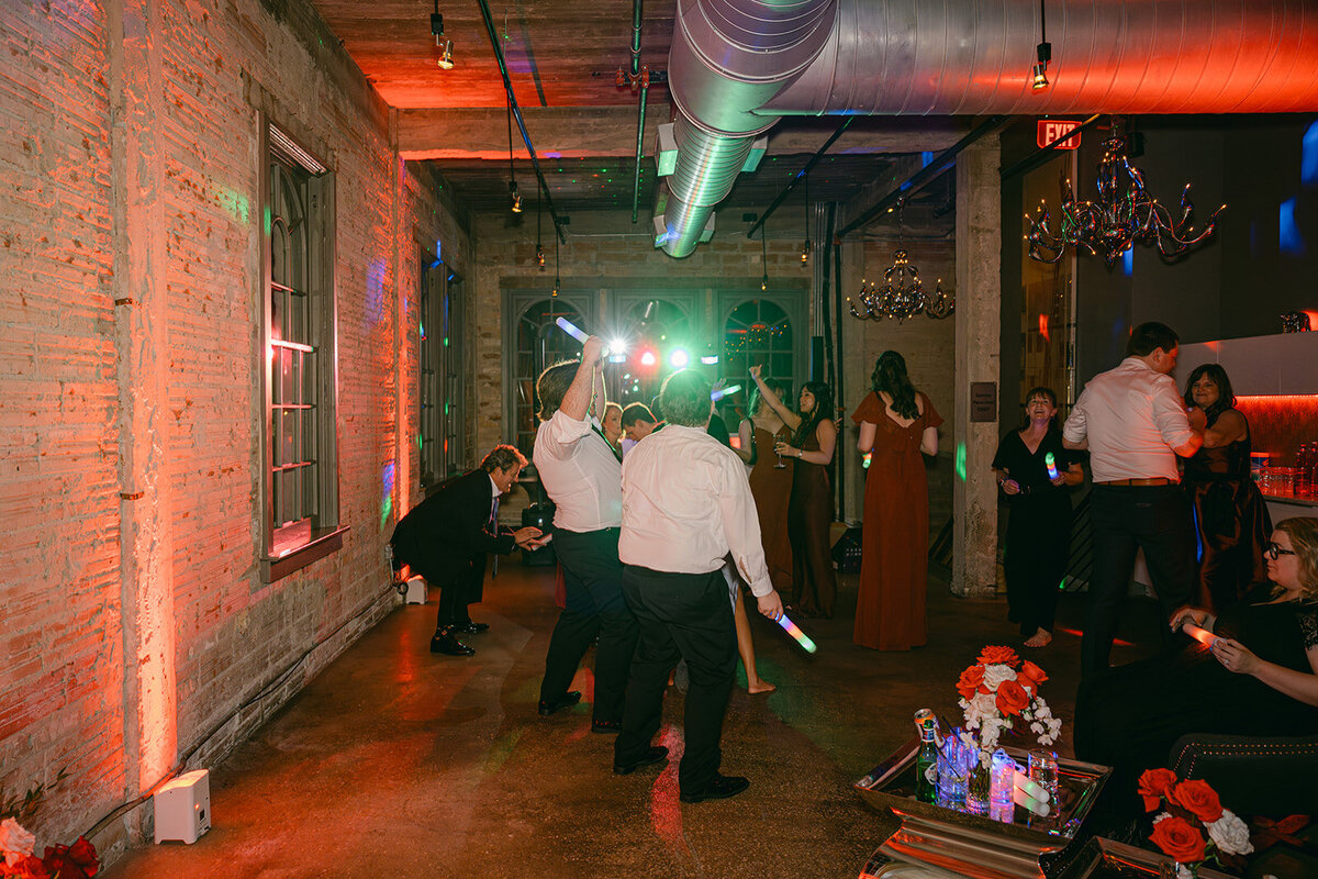 San Antonio city view captured through red-lit window at The Battalion wedding venue during upscale evening reception