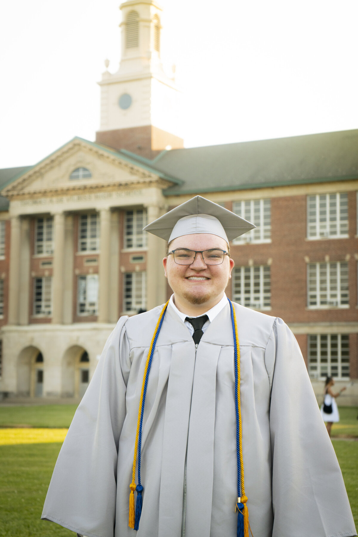 Photo of a graduating high school senior in his cap and gown