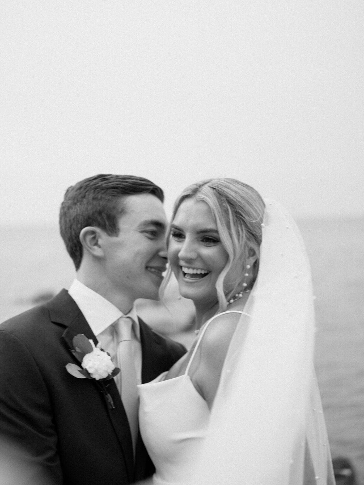 Classic bride and groom portrait with lake in the background
