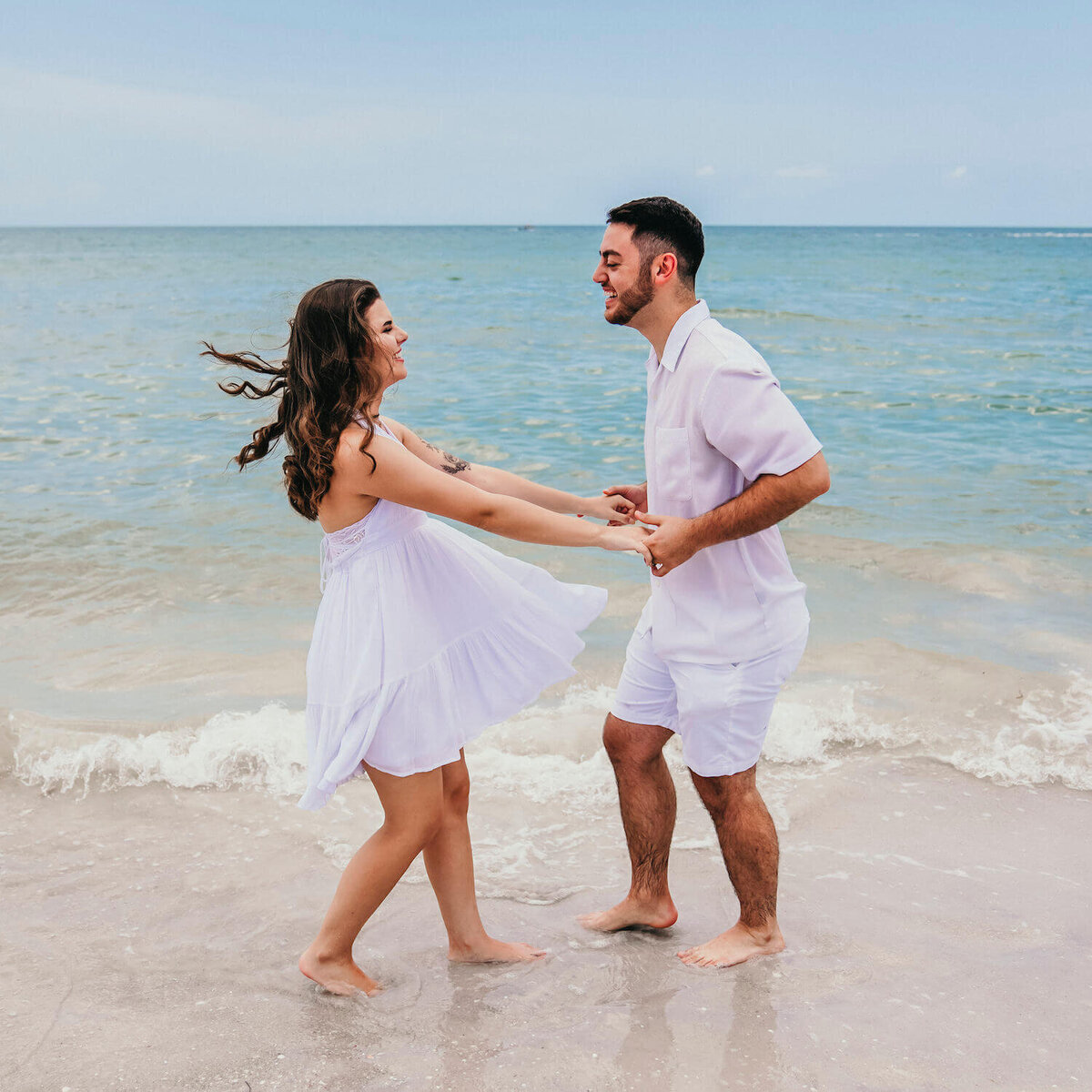 engagement_photography__myrtle-beach -_couple_on_beach_smiling