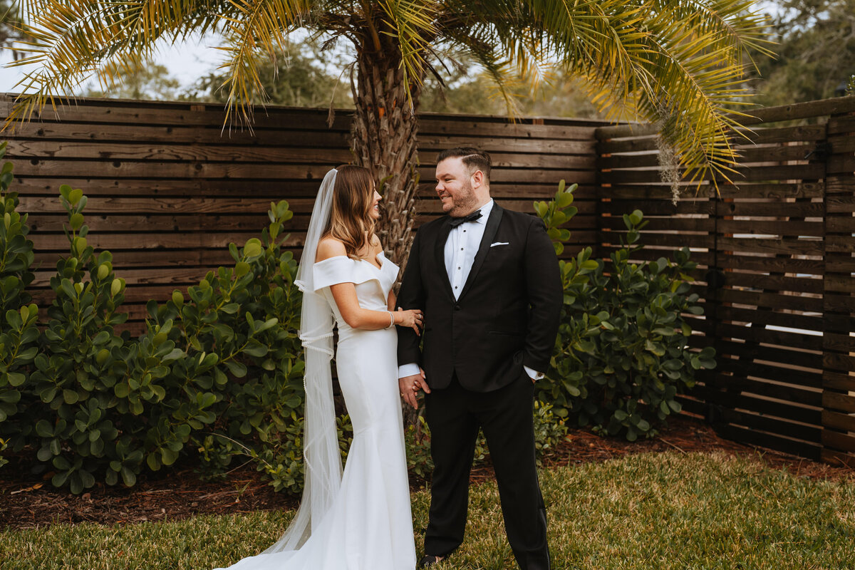 bride and groom smiling at each other at the fenway hotel in dunedin florida