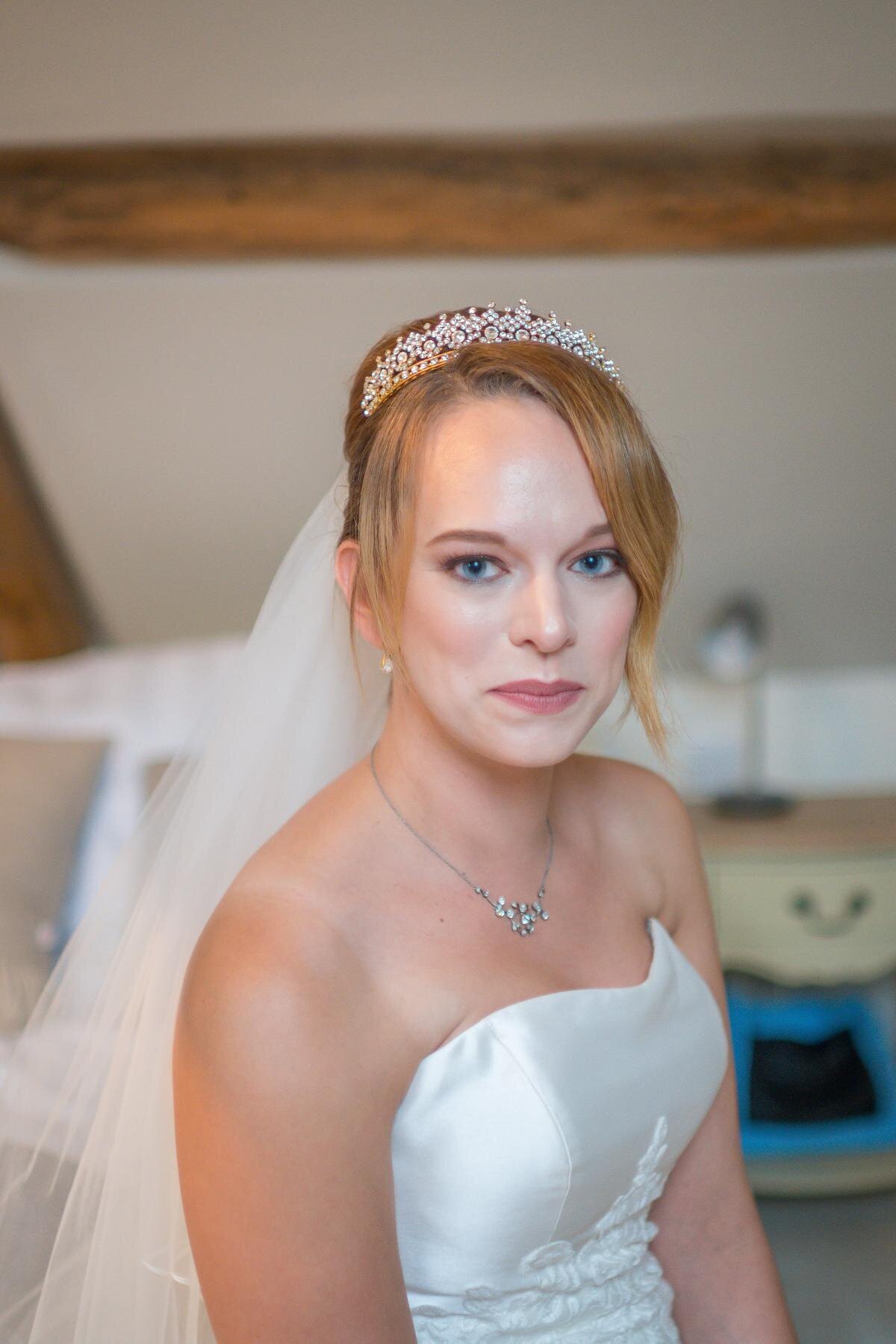 Natural bride hair and makeup wearing tiara