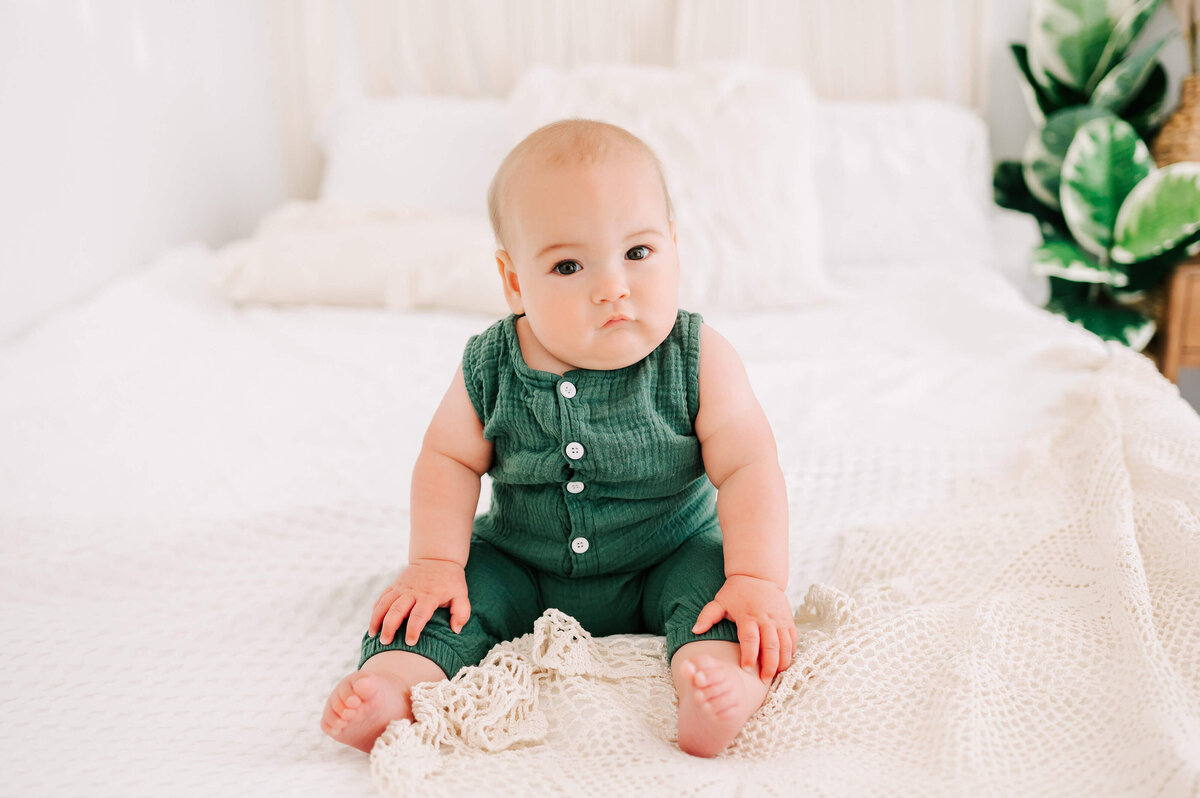 baby picture in Springfield MO of baby boy in green romper