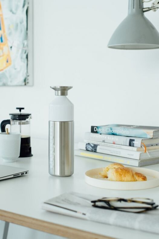 A modern workspace with minimalist decor, representing Ilse Vonk's role as a CEO for Dopper
