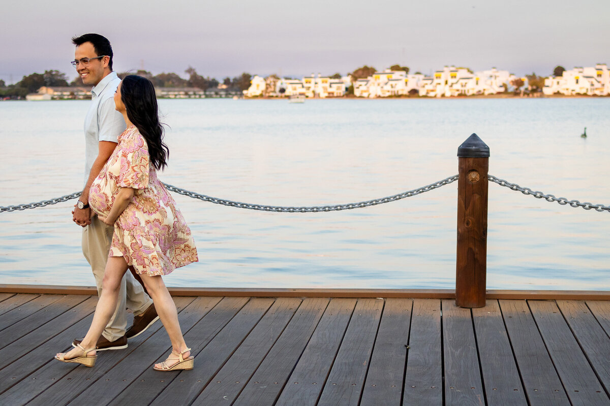 Expecting couple strolling along the waterfront during golden hour — Bay Area Maternity Portfolio - Ellobelle Photography