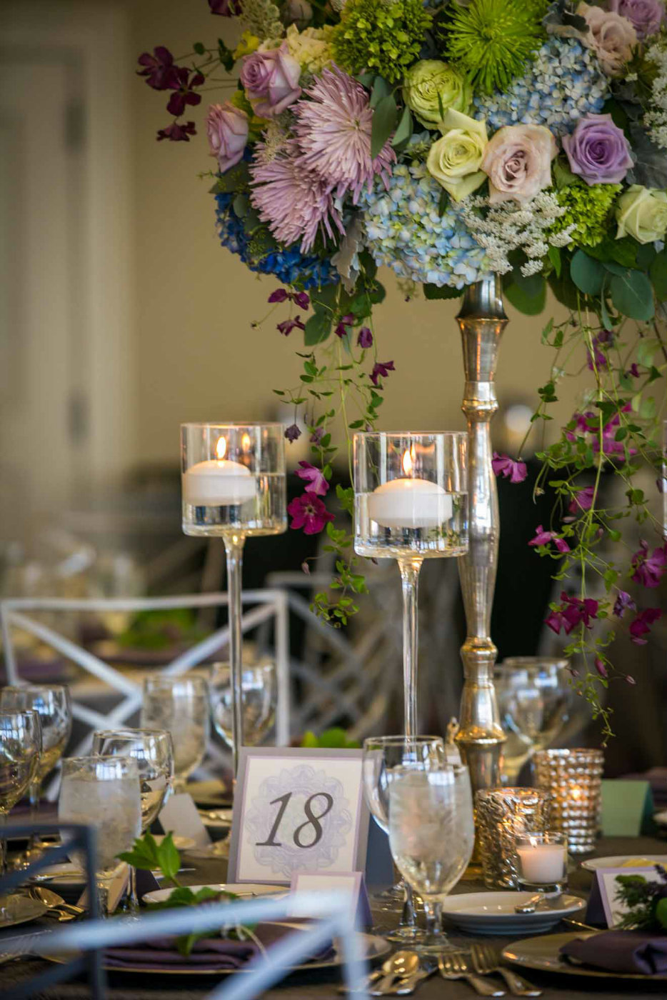 blue and purple centerpiece with floating candles