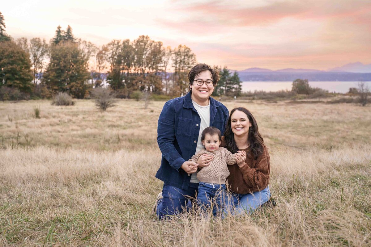 Seattle Family Photographer Outdoors Discovery Park Baby Parents with Sunset Glam Lana Stewart Studios