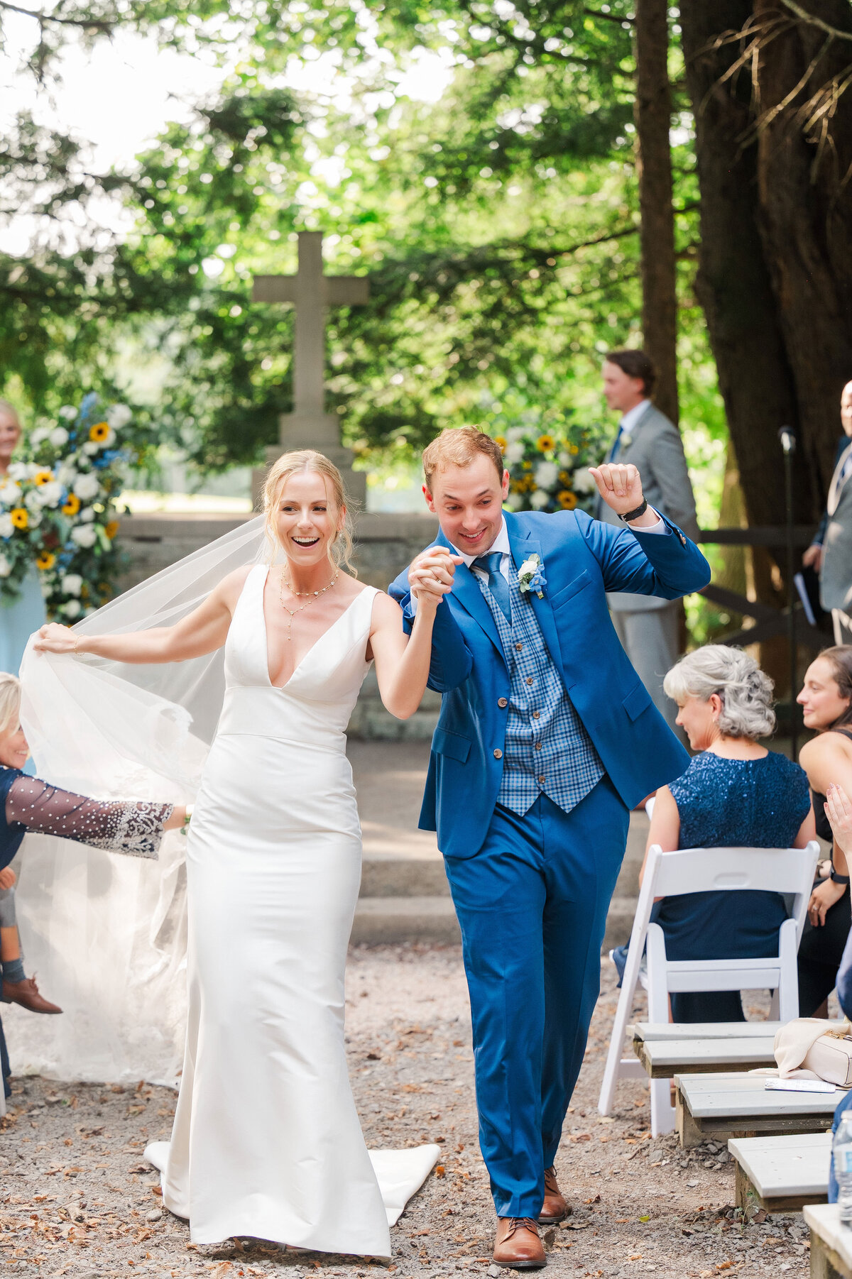 couple leaving wedding ceremony and cheering at YMCA Camp Kon-O-Kwee event