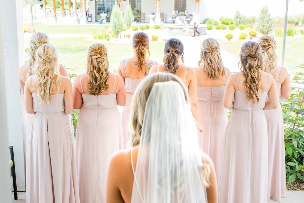 bridesmaids line up before turning around to see bride
