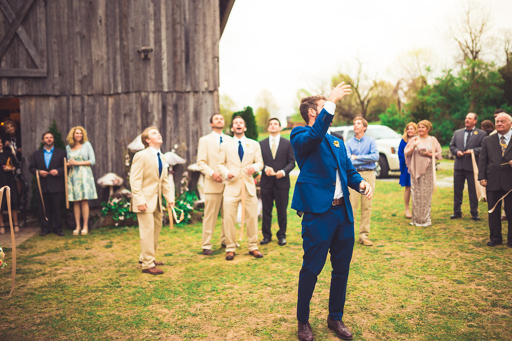 Wedding Photograph Of Men Catching The Wedding Garter