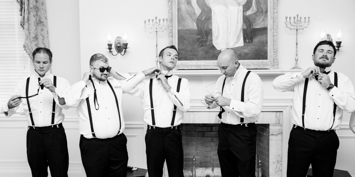 TFWC Mansion wedding photographer groom groomsmen tying bow ties 2312 San Gabriel St, Austin, TX 78705