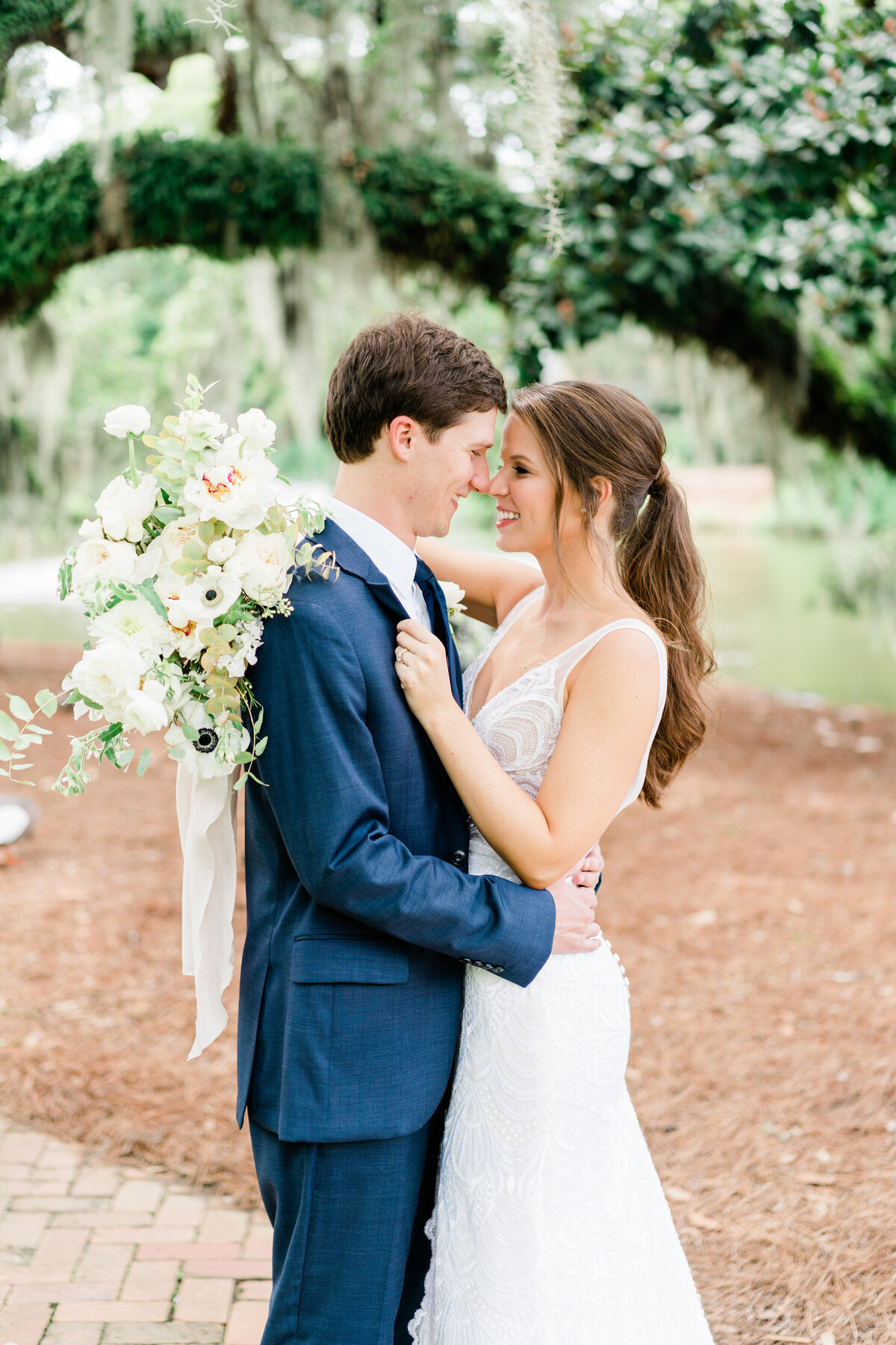 Bride and groom smiling at each other in Alabama