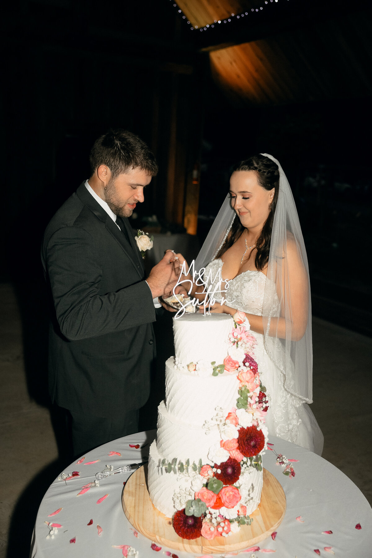 Couple Cutting Three-Tier Floral Wedding Cake | Oregon Wedding Reception Photography