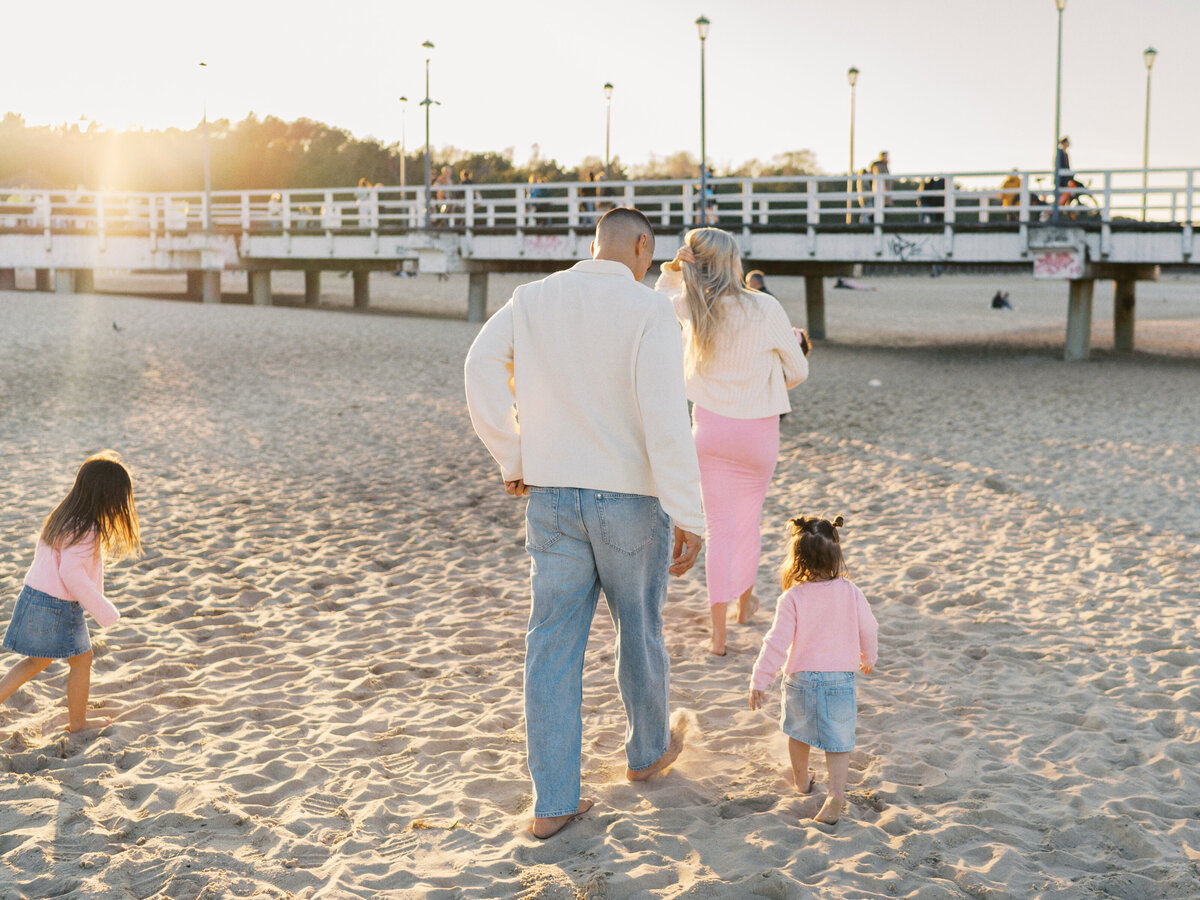 family-walking-at-the-beach
