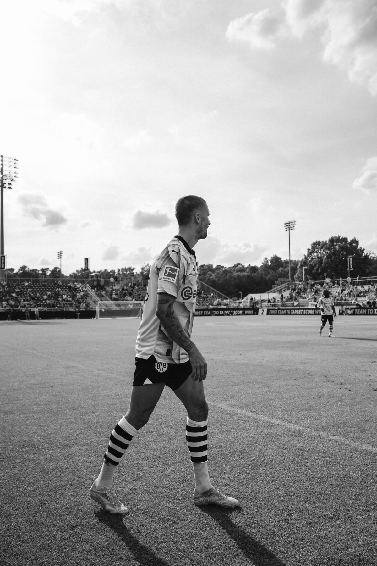 Professional football soccer player Moritz Leitner lining up a corner kick at TST 2024 in Cary, NC. Black and white photo was taken during match vs Bayern Munich.