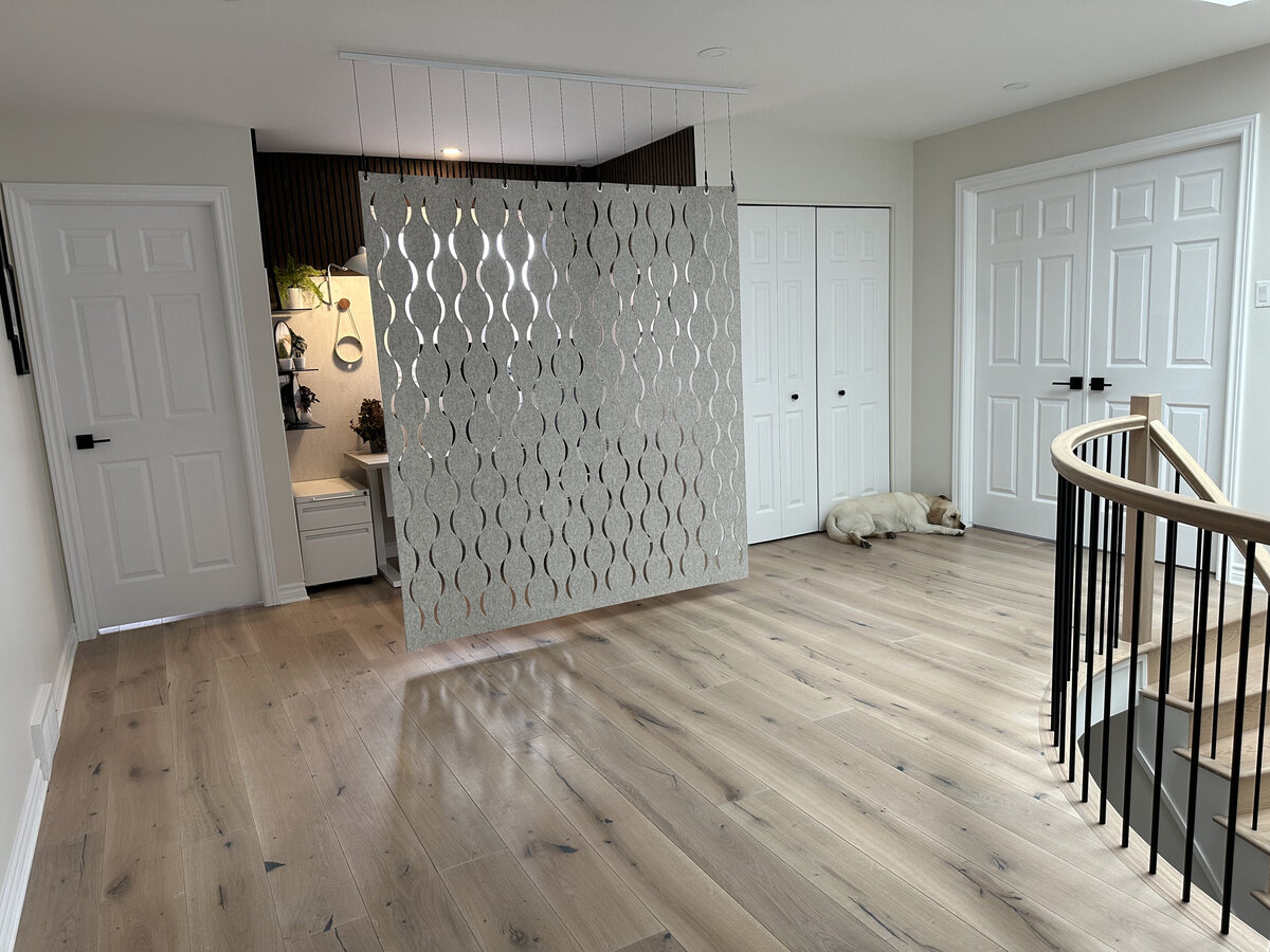 Distressed hickory hardwood adds warmth to this 2nd floor hallway with home office nook boasting a natural felt divider.
