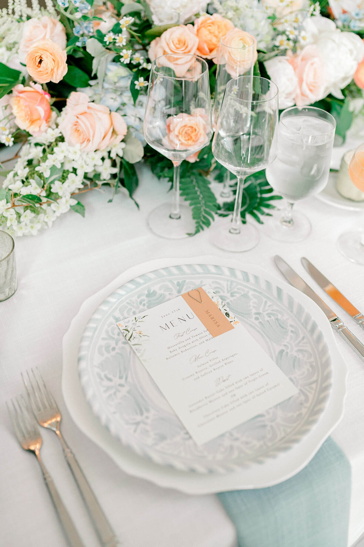 Detail wedding photography of blue and pink tuscan inspired tablescape