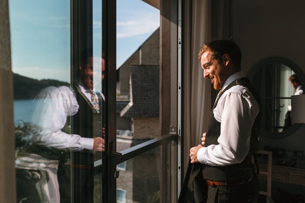 Grrom gets ready by sunny window 