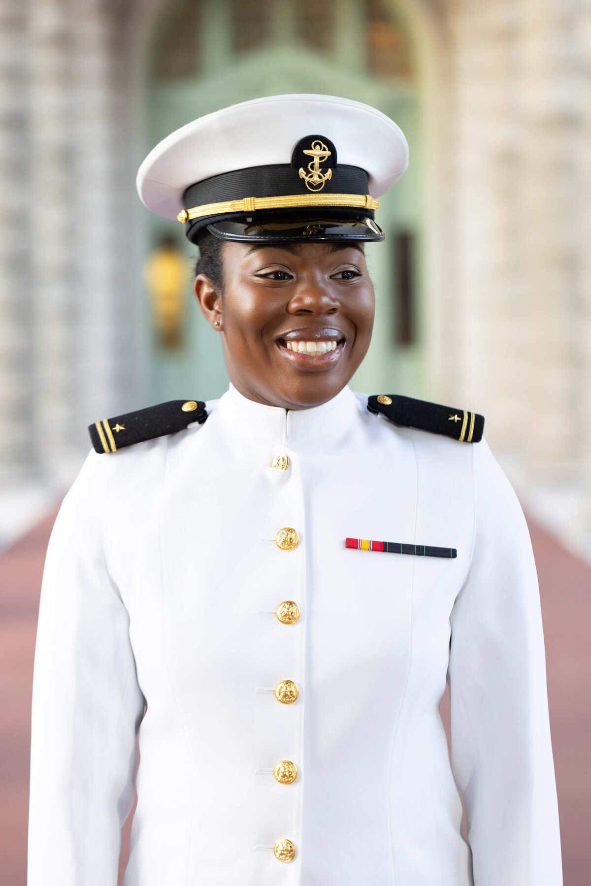 Navy officer in white uniform.