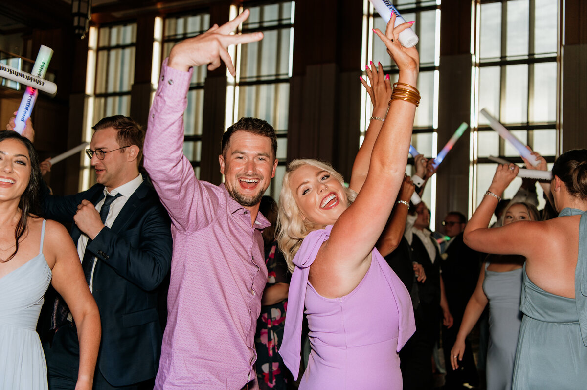 Wedding guests celebrating and dancing reception
