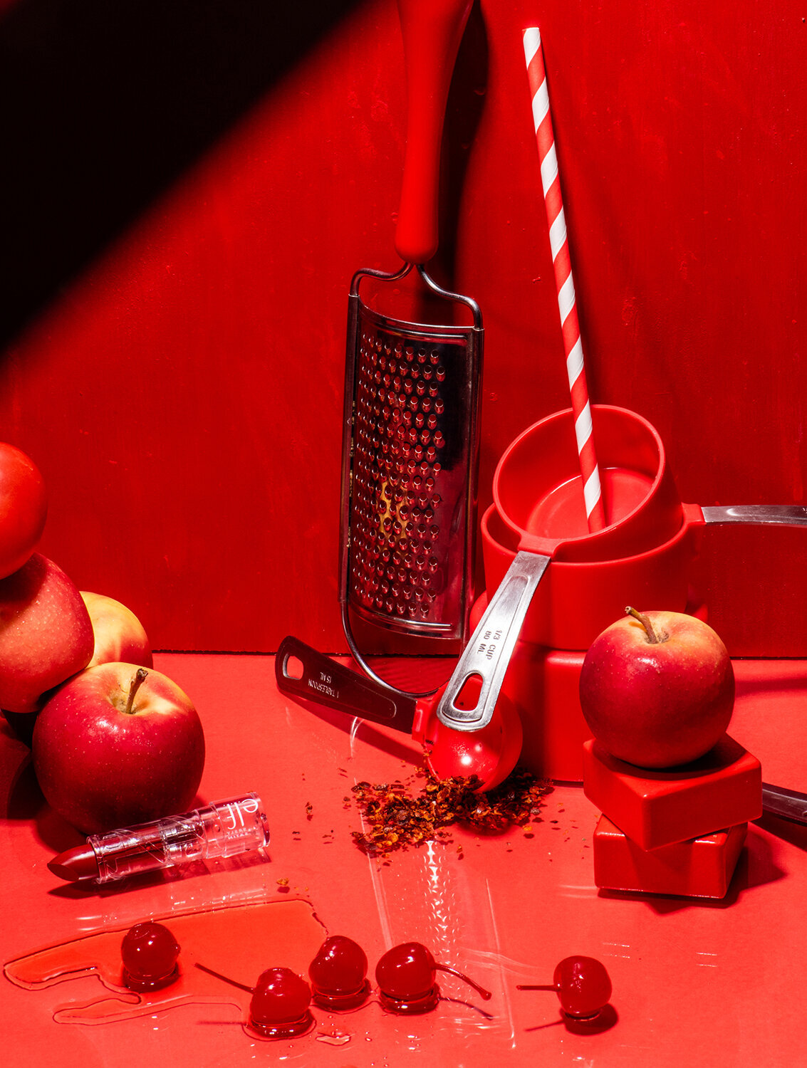 monochromatic red product still life