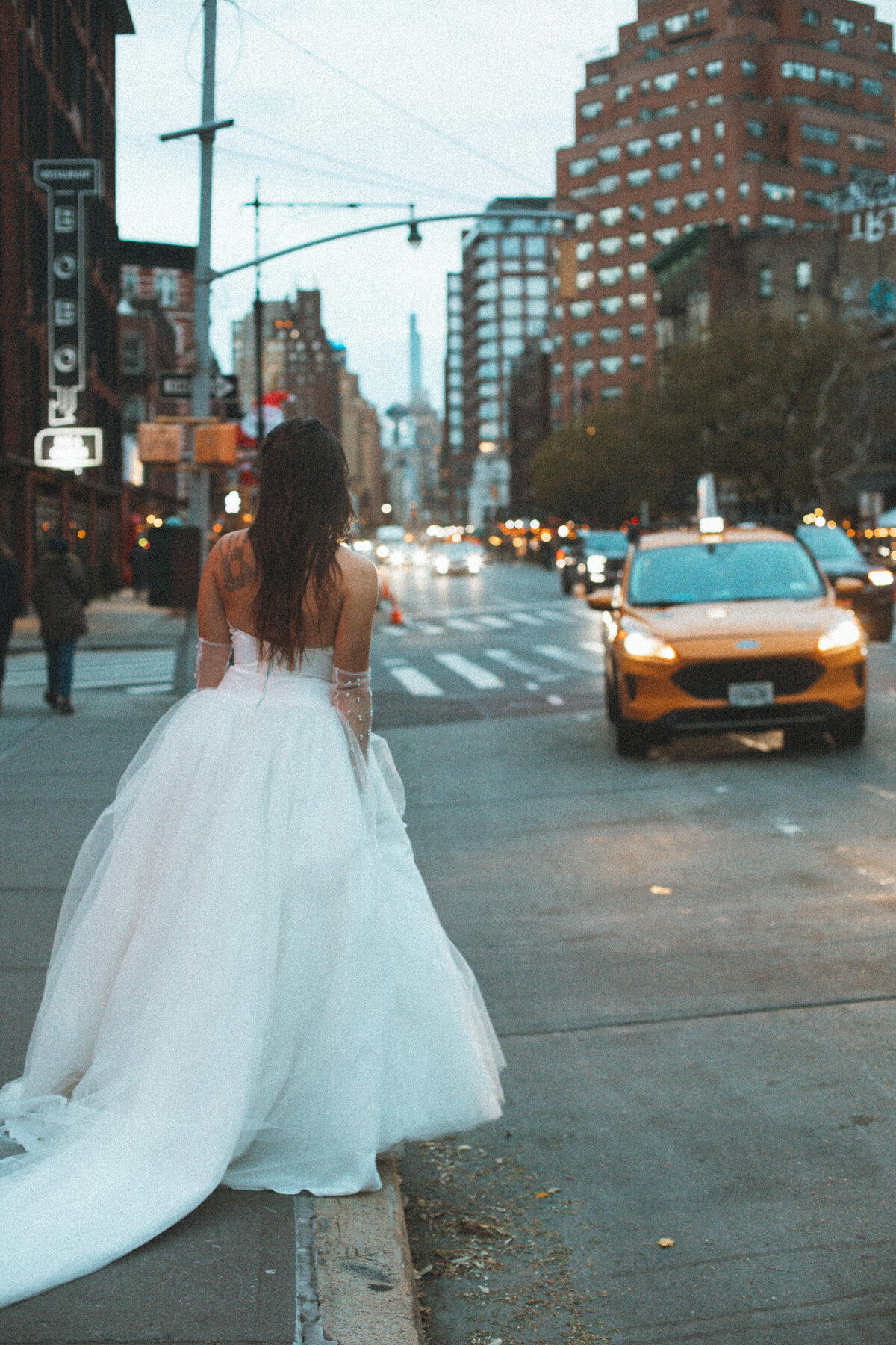 bride hailing taxi in nyc