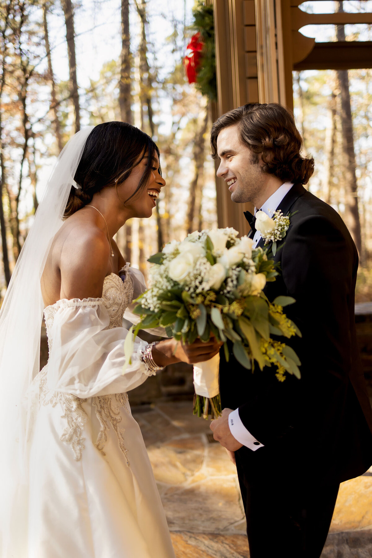 a bride and groom laugh before the ceremony