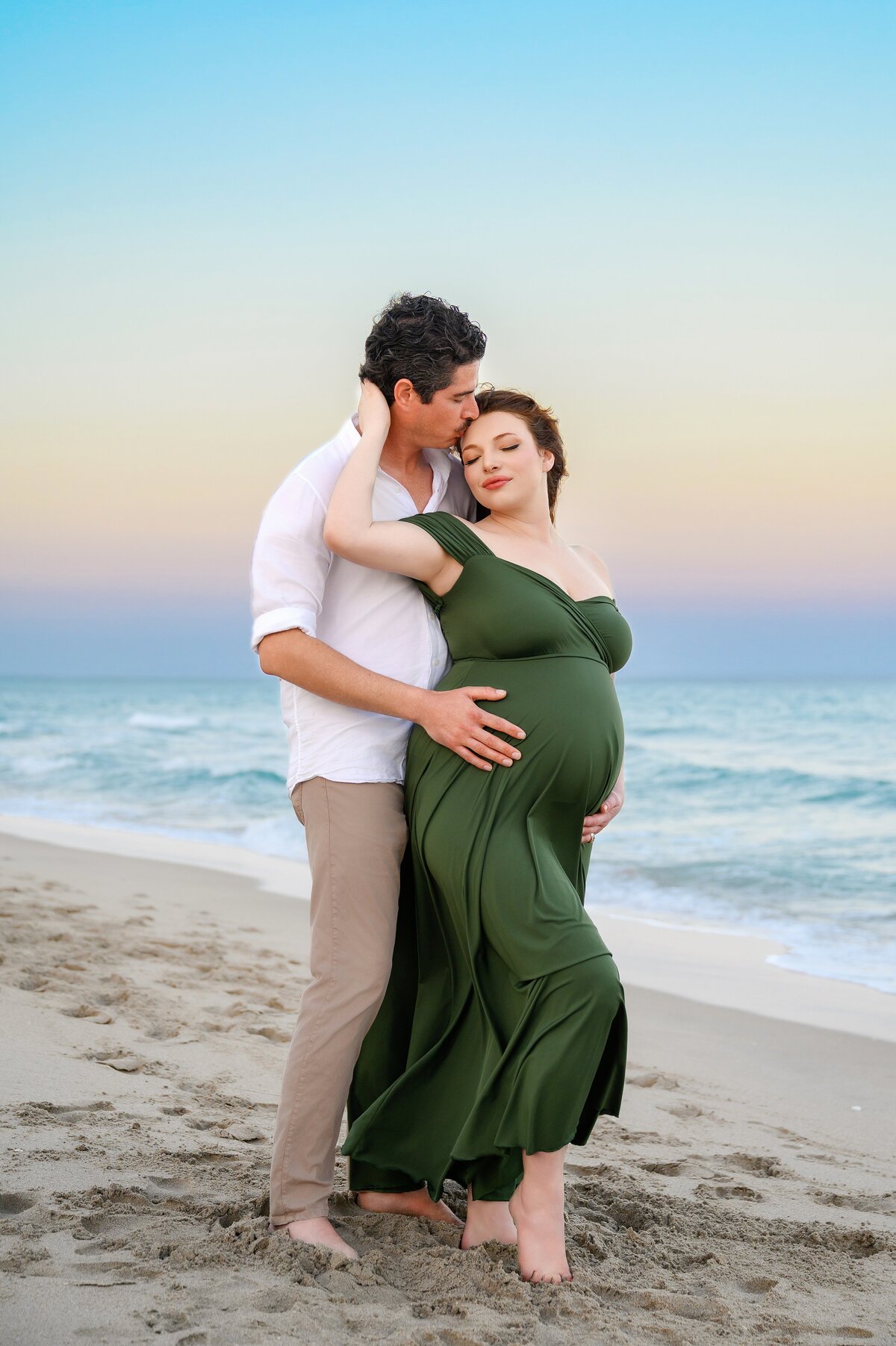 Palm Beach Island Maternity Photoshoot on South County Road to celebrate pregnancy in vibrant sunset on a private beach.