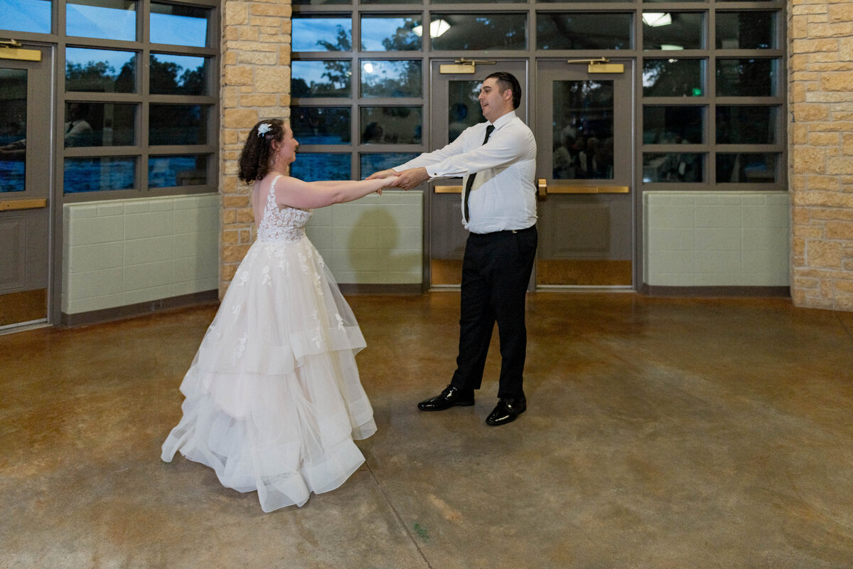Couple holding hands walking in forest