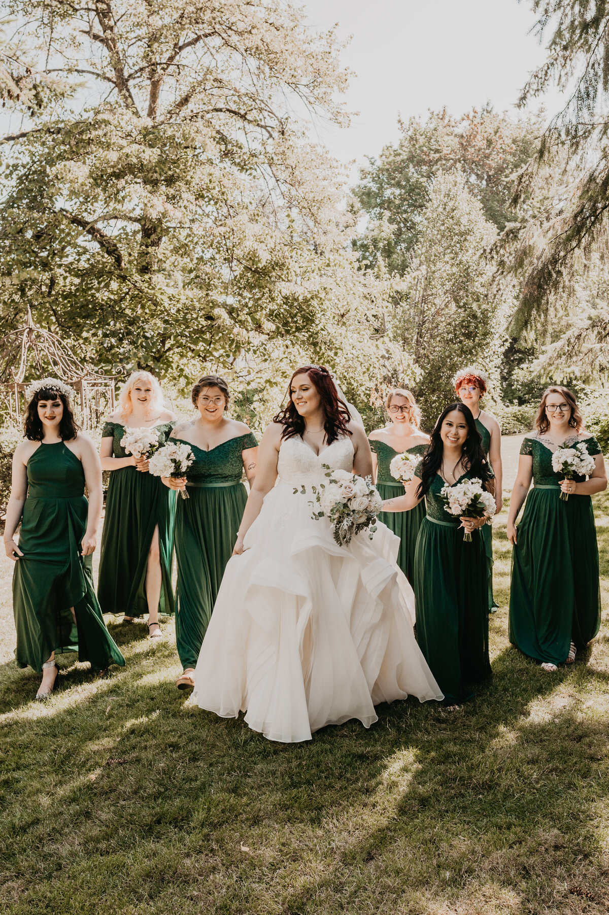 Bridesmaids in emerald green dresses.