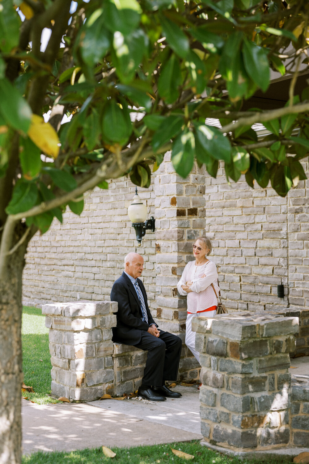 guests-chatting-underneath-magnolia-tree