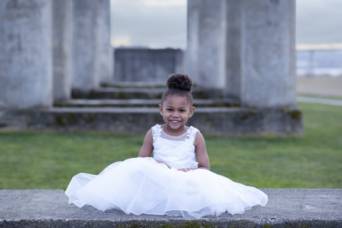 Girl in white dress sitting