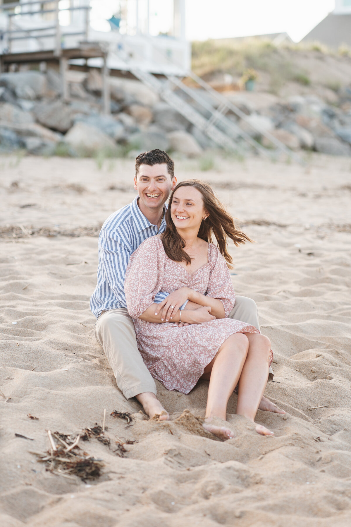Natural and timeless engagement photos at the beach, capturing genuine moments by the ocean.