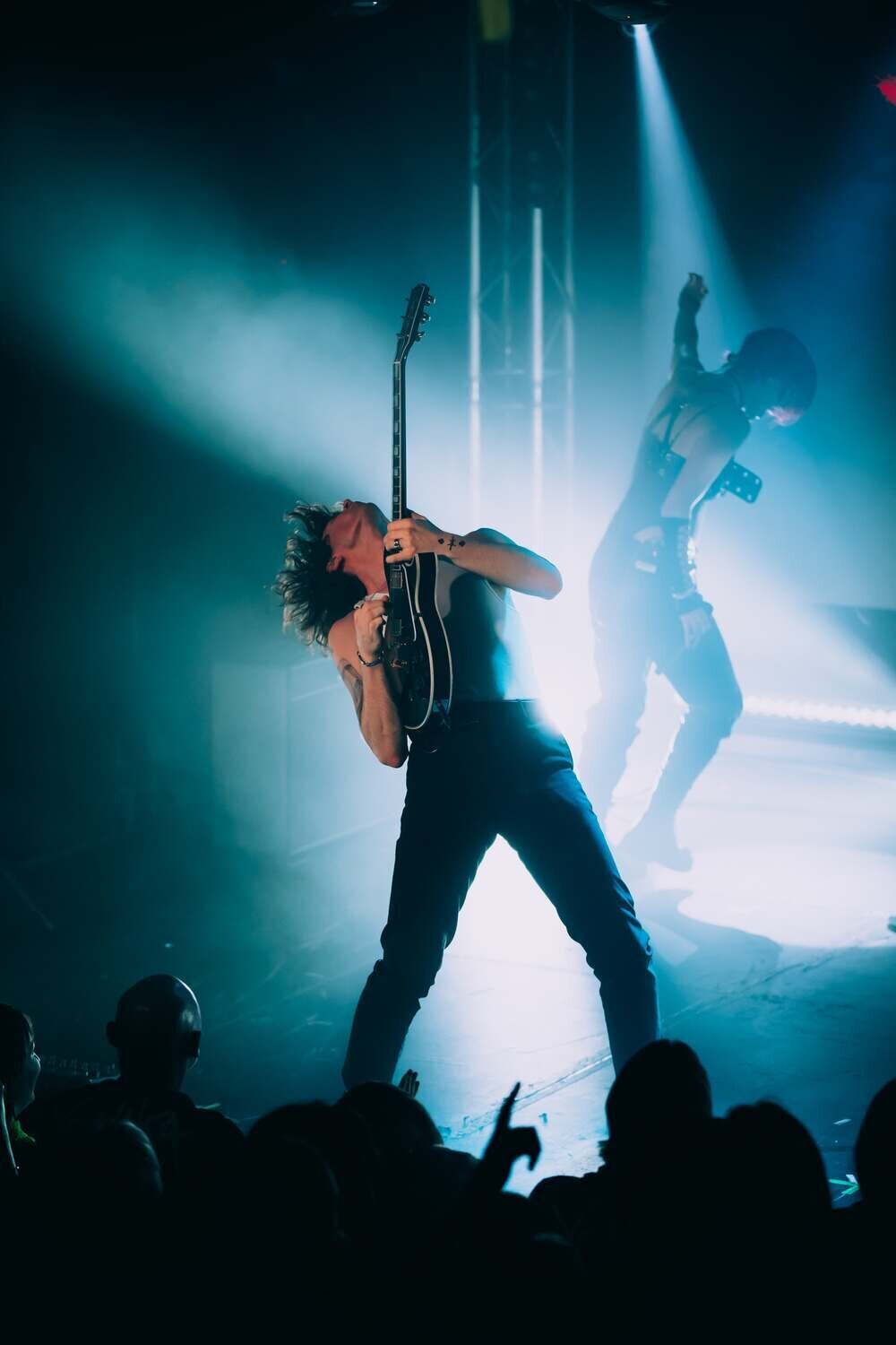 Yonaka guitarist with head back points guitar towards the sky