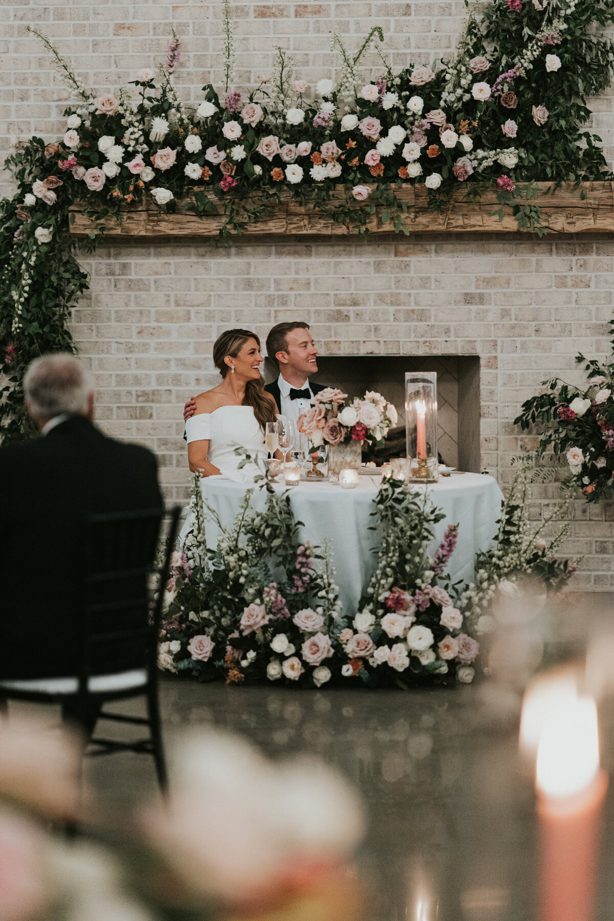 couple at their head table during speeches
