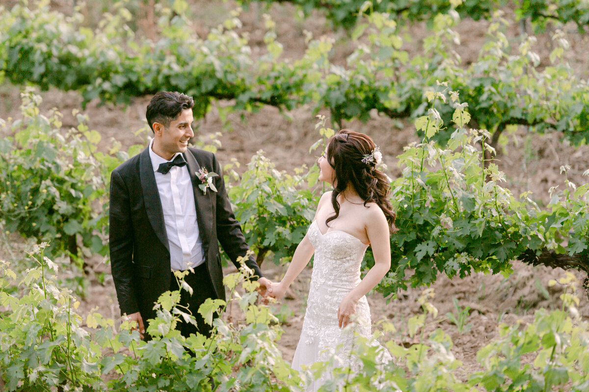 An unforgettable wedding moment surrounded by lush bougainvillea and golden light—captured with soft elegance by Los Angeles Top Destination Wedding Luxury Photographer Michael Asmussen. From Temecula Valley Wine Country to Tuscany, Italy this image embodies timeless beauty, couture bridal styling, and modern romance with a soulful lens.

