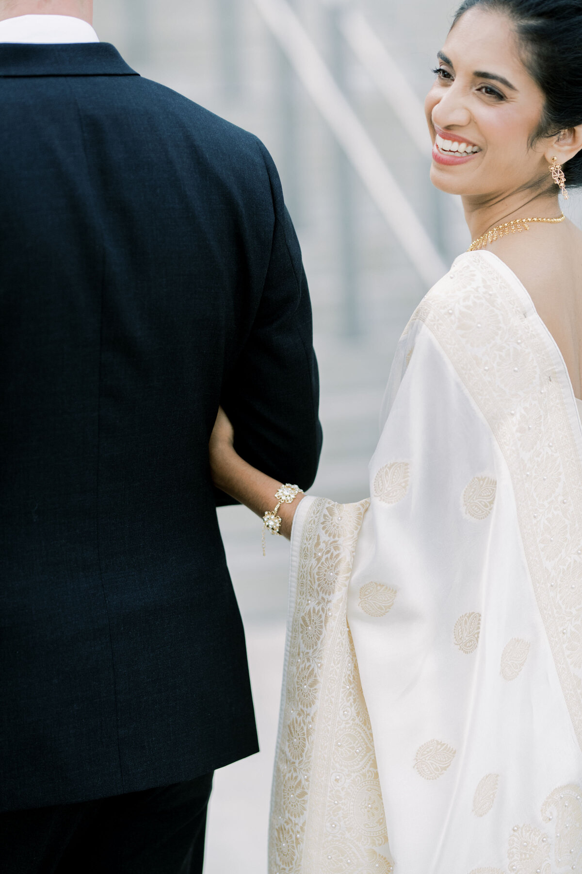 bride and groom walking together just a detail shoot