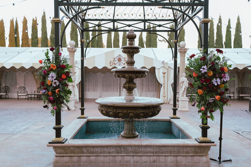 gazebo at grand island mansion patio with jewel toned flowers