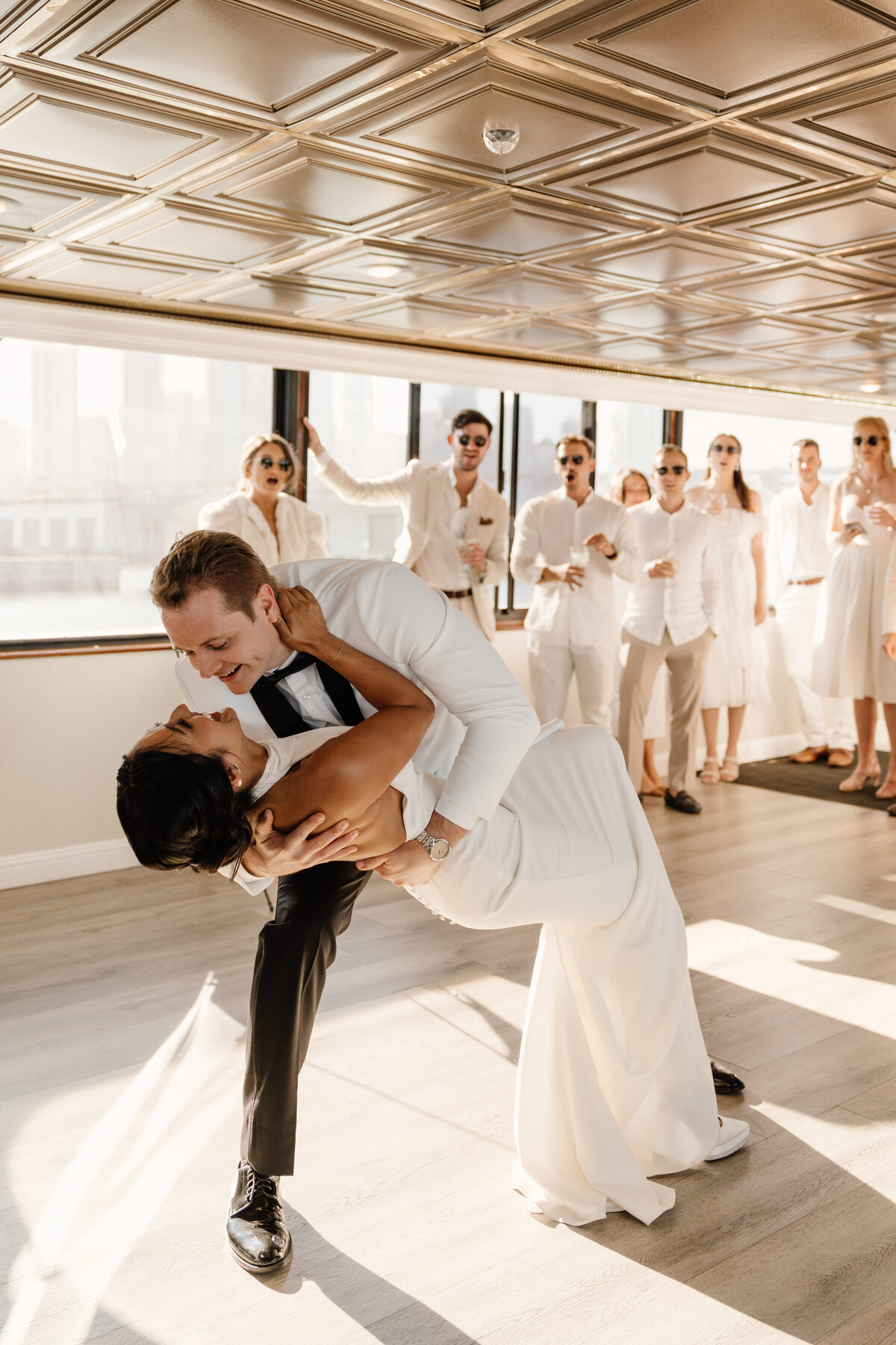 bride and groom first dance on boat reception