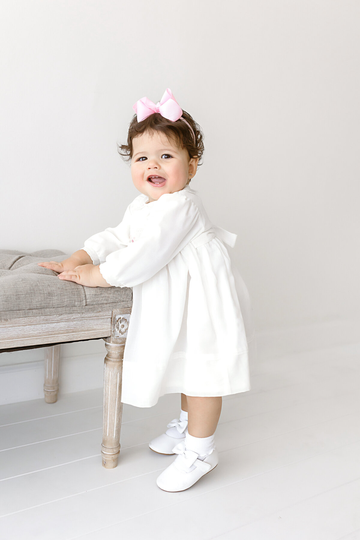 smiling toddler girl standing